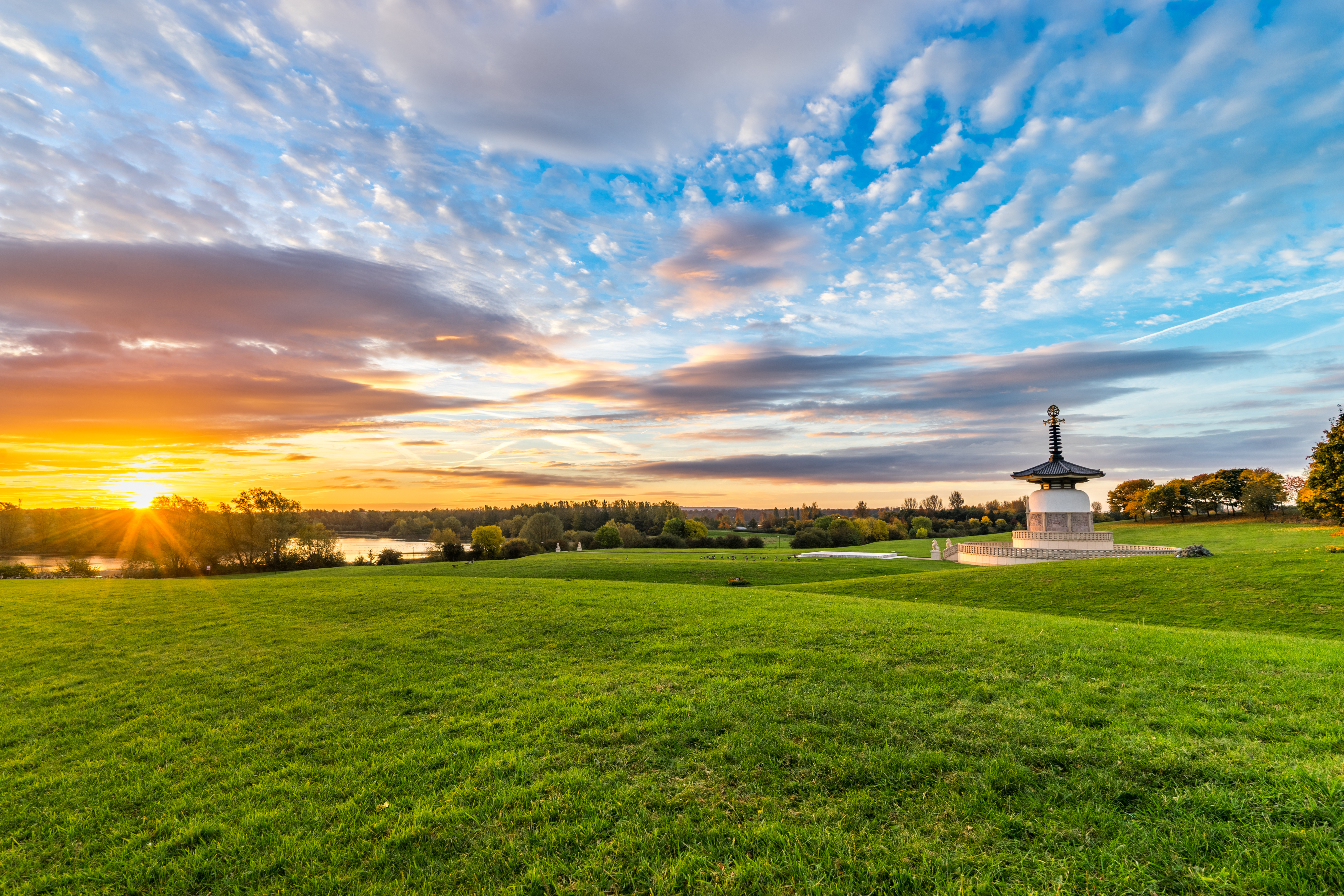 Panorama of Peace Pagoda temple at sunrise in Willen Park, Milton Keynes
